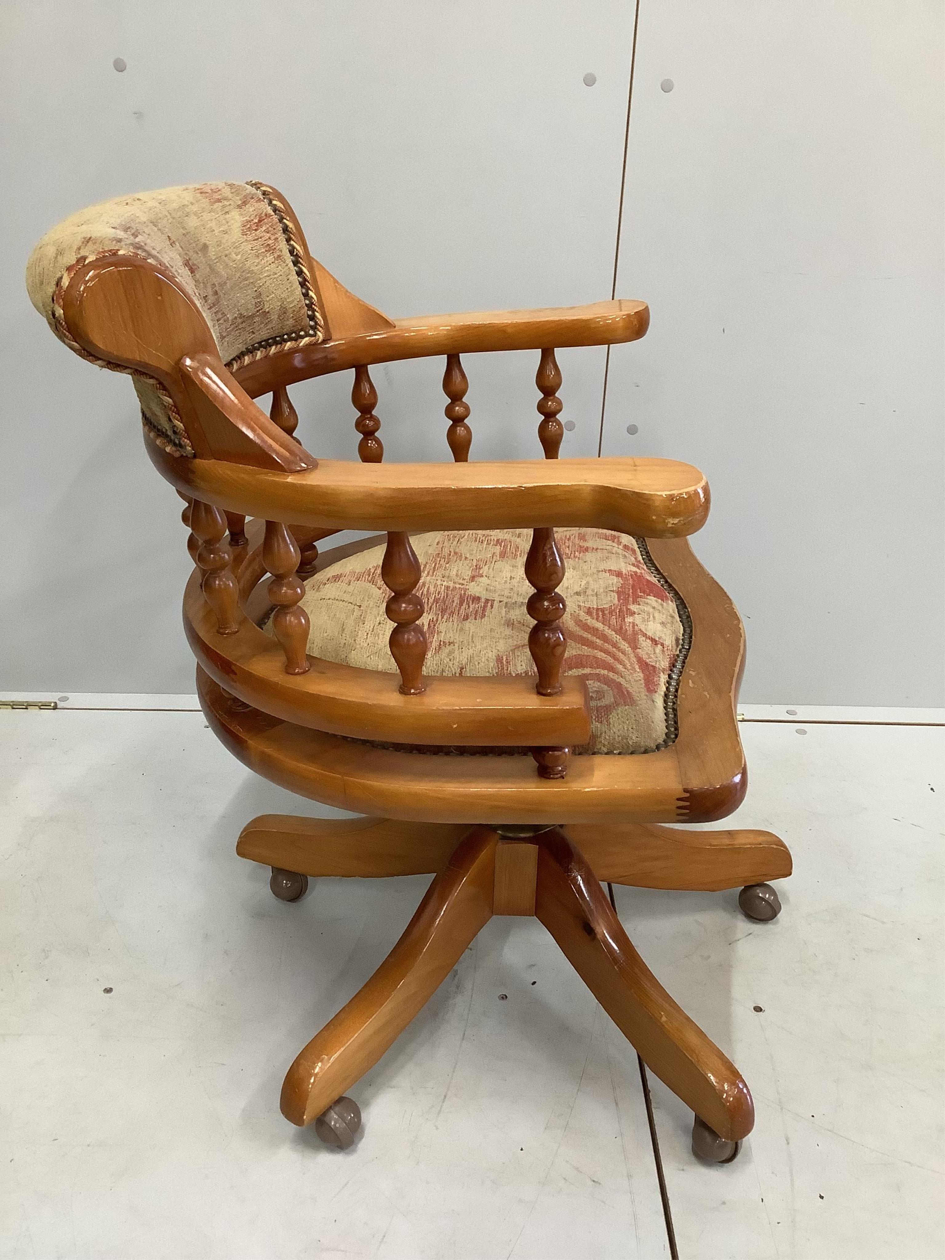 A Victorian style pine swivel desk chair, width 62cm, depth 53cm, height 82cm